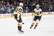 Vegas Golden Knights Brayden McNabb, right, celebrates with Shea Theodore, left, who scored the winning goal during the overtime period of Game 4 of a first-round NHL hockey Stanley Cup playoff series against the Utah Mammoth, Monday, April 27, 2026, in Salt Lake City. (AP Photo/Tyler&nbsp;Tate)