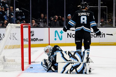 Utah Mammoth goaltender Karel Vejmelka, bottom, lays on the ice looking at the puck after giving up the winning goal during the overtime period of Game 4 of a first-round NHL hockey Stanley Cup playoff series against the Vegas Golden Knights, Monday, April 27, 2026, in Salt Lake City. (AP Photo/Tyler Tate)