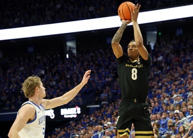 Vanderbilt’s Tyler Harris (8) looks to shoot while defended by Kentucky’s Collin Chandler, left, during the second half of an NCAA college basketball game in Lexington, Ky., Saturday, Feb. 28,&nbsp;2026. 
