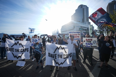 Fans of the Vancouver Whitecaps MLS soccer team rally to keep the team in Vancouver, Thursday, April 30, 2026, outside the 76th FIFA Congress in Vancouver, British&nbsp;Columbia. 