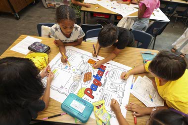 In Anna Comia’s third-grade classroom at Ortwein Elementary School, more than half of the children have Asian or Pacific Islander heritage.

