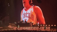 The country star stepped out in a Larry Johnson No. 4 UNLV basketball jersey during part of his performance at Allegiant Stadium, giving a nod to Las Vegas basketball royalty.