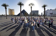 Survivors, family, and community members pose with photos of the 58 victims in what will be the Remembrance Ring during a media event at the site of the Forever One Memorial Thursday, May 7,&nbsp;2026.
