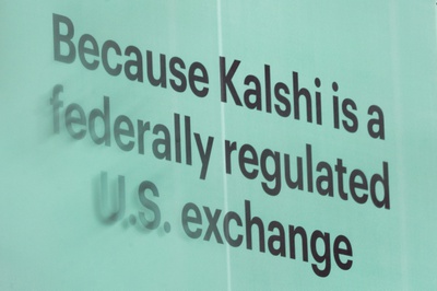 An advertisement for prediction market platform Kalshi hangs at 13th and L Street NW in Washington, Wednesday, April 1, 2026. 