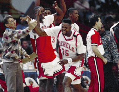 Former UNLV assistant coach Tim Grgurich, far left, celebrates with his players following a 90-81 victory over Georgia Tech in the NCAA tournament’s national semifinals on March 31, 1990 in Denver,&nbsp;Colo. 