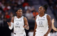 Las Vegas Aces guards Jackie Young (0) and Chelsea Gray (12) talk as they head off the court for a time out during the second half of an WNBA basketball game against the Phoenix Mercury at T-Mobile Arena Saturday, May 9,&nbsp;2026.