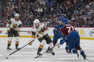Vegas Golden Knights center Jack Eichel (9) drives with the puck as Colorado Avalanche defenseman Brett Kulak (27) and center Martin Necas (88) defend while Golden Knights defenseman Noah Hanifin (15) trails the play during the second period in Game 2 of the Western Conference finals NHL hockey Stanley Cup playoff series Friday, May 22, 2026, in&nbsp;Denver.
