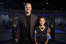 Nick Kalikas, left, owner of the Nevada Sport Karate League and Noah Kalikas, 10, World Kickboxing and Karate Union competitor for the USA Team, pose ...