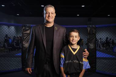 Nick Kalikas, left, owner of the Nevada Sport Karate League and Noah Kalikas, 10, World Kickboxing and Karate Union competitor for the USA Team, pose for a photo during Battle of Las Vegas International Martial Arts Championships at World Market Center Saturday, May 23,&nbsp;2026.