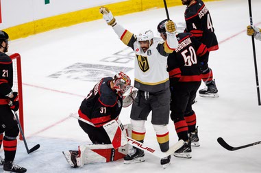 Vegas Golden Knights’ Keegan Kolesar, middle, celebrates between Carolina Hurricanes’ Frederik Andersen (31) and Eric Robinson (50) after a goal scored by Golden Knights’ Shea Theodore in the first period of Game 1 of the NHL hockey Stanley Cup Final series in Raleigh, N.C., Tuesday, June 2,&nbsp;2026.