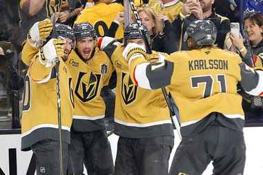 Vegas Golden Knights center Brett Howden, second from left, celebrates with teammates after scoring against the Carolina Hurricanes during the second period in Game 4 of the NHL hockey Stanley Cup Final series at T-Mobile Arena Tuesday, June 9, 2026, in Las&nbsp;Vegas.
