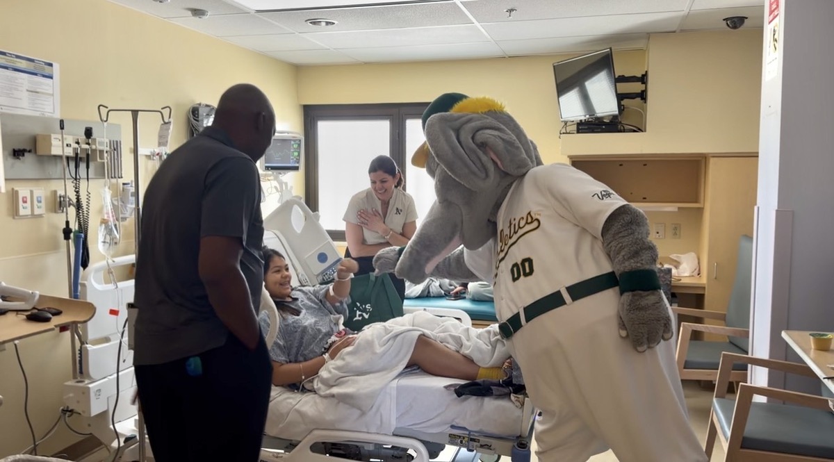 Athletics legends and mascot Stomper surprise Las Vegas pediatric patients