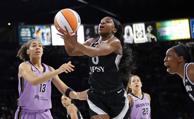 Las Vegas Aces guard Jackie Young (0) makes a rebound as Golden State Valkyries forward Janelle Salaun (13) and guard Veronica Burton (22)  look on during the first half of an WNBA basketball game at Michelob Ultra Arena in Mandalay Bay Sunday, June 21, 2026. Las Vegas Aces guard Chelsea Gray (12) reacts at&nbsp;right.