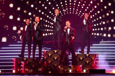 New Kids on the Block perform in tuxedos during a segment of their Las Vegas residency at Dolby Live at Park MGM in February 2025. From left are Danny Wood, Donnie Wahlbert, Joey McIntyre, Jordan Knight and Jonathan Knight. The residency continues in 2026 with select dates through Oct.&nbsp;17.