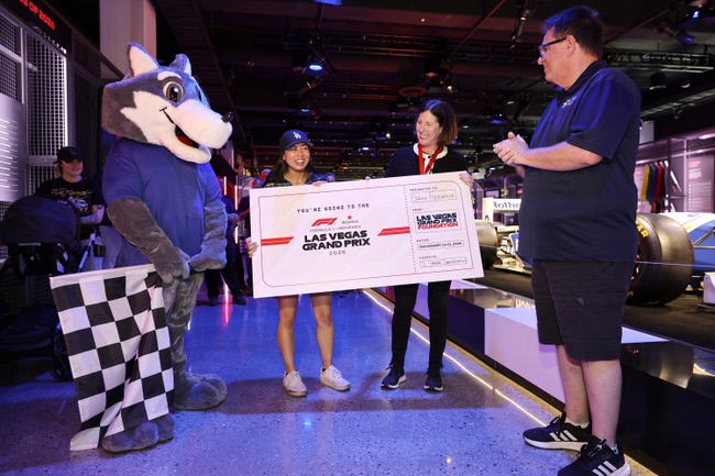 Shianne Fontanilla, second from left, and Lori Nelson, senior vice president of community affairs for the Las Vegas Grand Prix, pose with an oversized mockup of a ticket (for 2) to the Formula 1 Heineken Las Vegas Grand Prix 2026, in celebration of Women in Automotive Day, during a ceremony in the Grand Prix Plaza’s Legacy of Formula 1 Room Tuesday, June 30, 2026. Also pictured are Cody the Coyote, the College of Southern Nevada (CSN) mascot, and Scott Bennett, program director of the department of applied technologies and transportation technologies at CSN. Fontanilla recently graduated from the Master Technician Associate of Applied Science program at CSN. 
