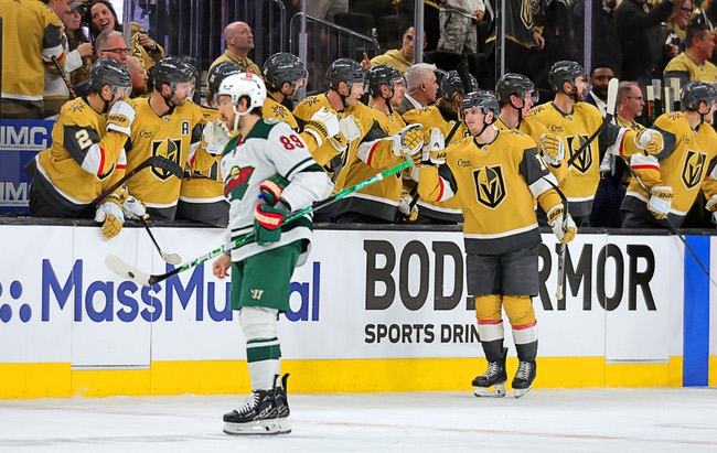 Vegas Golden Knights left wing Pavel Dorofeyev (16) is congratulated by teammates after scoring against the Minnesota Wildduring the second period of game one in an NHL hockey Stanley Cup first-round playoff series at T-Mobile Arena Sunday, April 20, 2025. Minnesota Wild center Frederick Gaudreau (89) skates away at left.