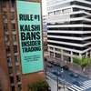 A Kalshi advertisement draped on a building at 13th and L streets in northwest Washington touts the prediction market platform’s federal regulation status, April 1, 2026. Democratic senators, including Nevada’s Jacky Rosen and Catherine Cortez Masto, are pushing to bar the Commodity Futures Trading Commission from using federal funds to block states from regulating platforms like Kalshi.