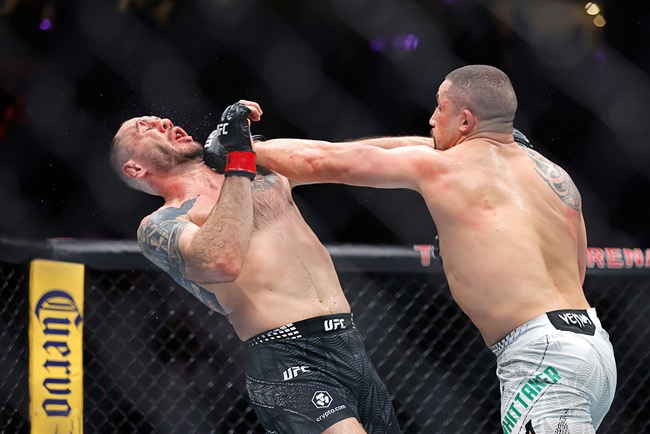 Robert Whittaker, right, punches Nikita Krylov in alight heavyweight bout during UFC 329 at T-Mobile Arena Saturday, July 11, 2026. Whittaker won the fight with a third-round TKO.
