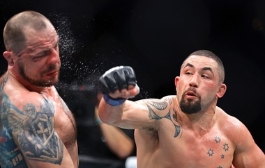Robert Whittaker, right, connects with a punch on Nikita Krylov in alight heavyweight bout during UFC 329 at T-Mobile Arena Saturday, July 11, 2026. Whittaker won the fight with a third-round TKO.