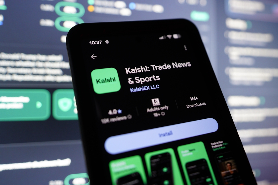 The Kalshi prediction markets app is displayed on a smartphone. Nevada U.S. Reps. Steven Horsford and Mark Amodei are pushing a bipartisan bill that would ban federally regulated platforms like Kalshi from offering sports betting under the guise of financial products.