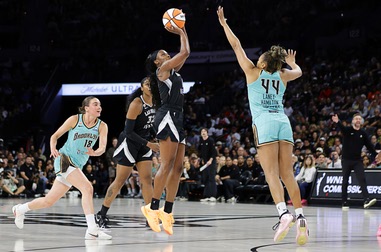 Las Vegas Aces guard Jackie Young (0) shoots between New York Liberty guard Pauline Astier (18) and guard-forward Betnijah Laney-Hamilton (44) during the second half of an WNBA basketball game at Michelob Ultra Arena in Mandalay Bay Tuesday, June 23, 2026. The Palms has scheduled three Aces watch parties during the remainder of the season, starting with the Aces’ Aug. 9, 2026, game against the Liberty in Brooklyn,&nbsp;N.Y.