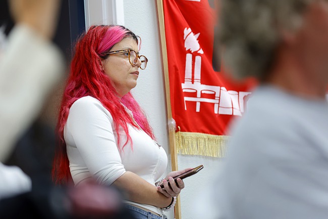 Val Thomason, an organizer with Progressive Leadership Alliance of Nevada (PLAN), listens to speakers during an event marking the fourth anniversary of the Dobbs Decision, a Supreme Court ruling that overturned Roe v. Wade, in downtown Las Vegas Wednesday, June 24, 2026.