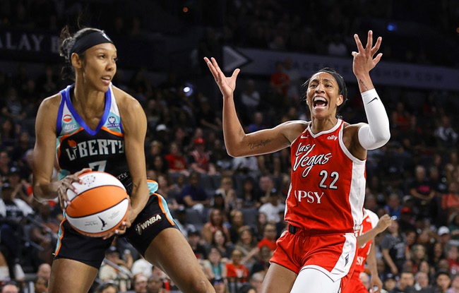 Las Vegas Aces center A'ja Wilson (22) reacts after missing a basket as New York Liberty guard Rebekah Gardner (7) makes the rebound during the first half of an WNBA basketball game at Michelob Ultra Arena in Mandalay Bay Thursday, July 30, 2026.