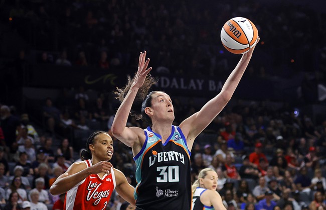 New York Liberty forward Breanna Stewart (30) makes a rebound ahead of Las Vegas Aces forward-center Brianna Turner (21) during the first half of an WNBA basketball game at Michelob Ultra Arena in Mandalay Bay Thursday, July 30, 2026.