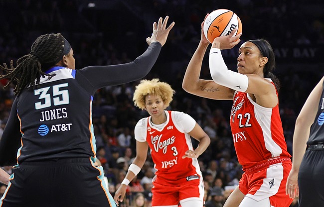 Las Vegas Aces center A'ja Wilson (22) prepares to shoot against New York Liberty center Jonquel Jones (35) during the first half of an WNBA basketball game at Michelob Ultra Arena at Mandalay Bay Thursday, July 30, 2026. Las Vegas Aces forward NaLyssa Smith (3) looks on at center.