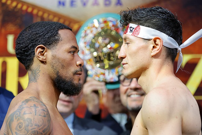Lightweight boxers Lamont Roach Jr., left,  and William Zepeda face off during a ceremonial weigh-in at Virgin Las Vegas Friday, July 31, 2026. The boxers are scheduled to fight for a vacant WBC lightweight title at the  hotel-casino Saturday.