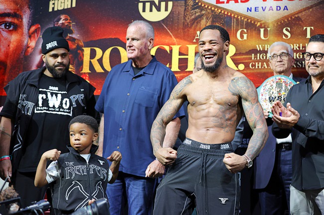 Amari Roach, 4, son of boxer Lamont Roach Jr., poses with his father during a ceremonial weigh-in at Virgin Las Vegas Friday, July 31, 2026. Lamont Roach Jr. and William Zepeda are scheduled to fight for a vacant WBC lightweight title at the  hotel-casino Saturday.