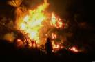 Firefighters battle large brush fire