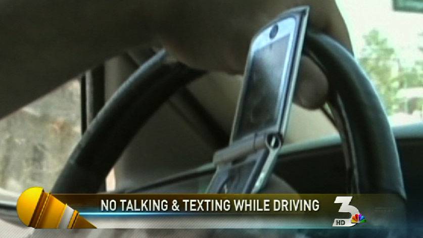 Law bans cell phone use while driving